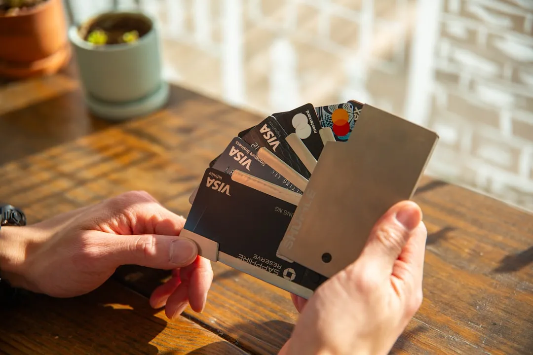 A person holding a credit card in their hand